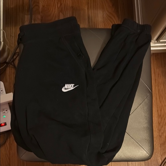 Nike Pants - Nike Black Joggers with Tapered Fit and Iconic Swoosh